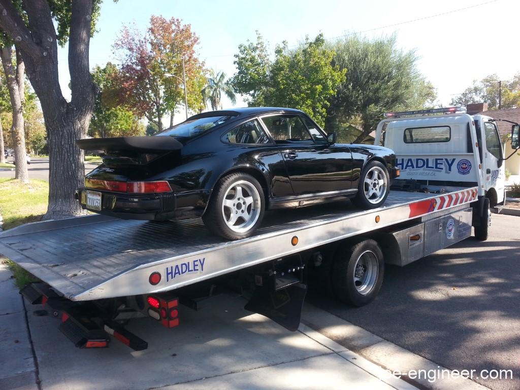 Porsche 911 on flatbed.